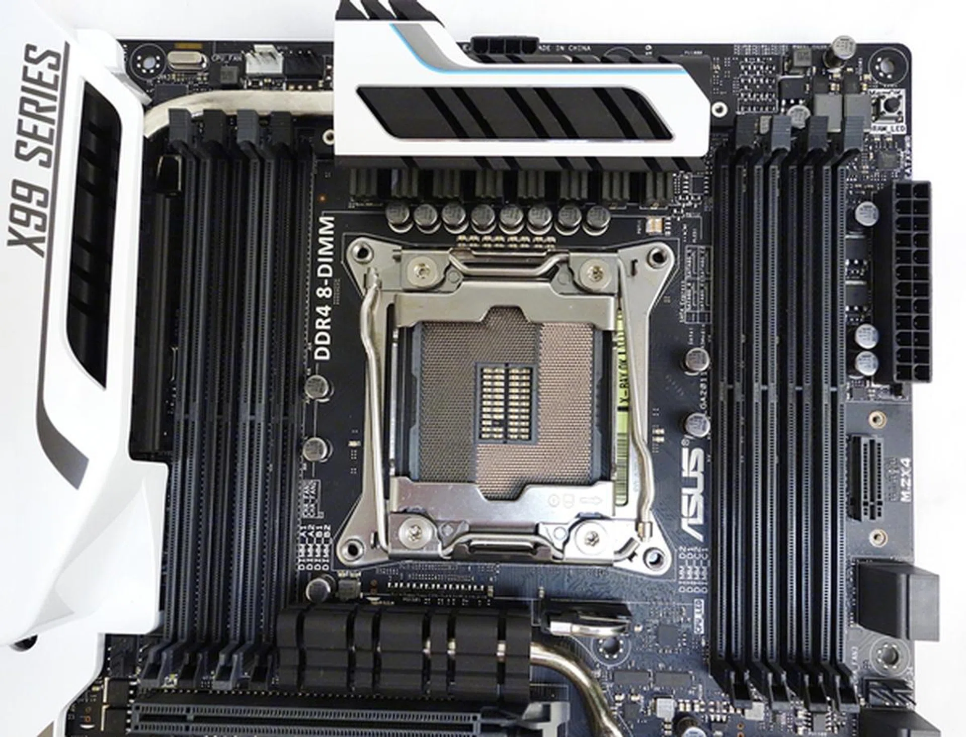 The LGA 2011-v3 CPU socket, with ASUS OC Socket feature, is flanked by four DDR4 DIMM slots on either side.