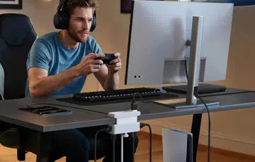 The Anker Nano Power Strip powering up the gaming setup.