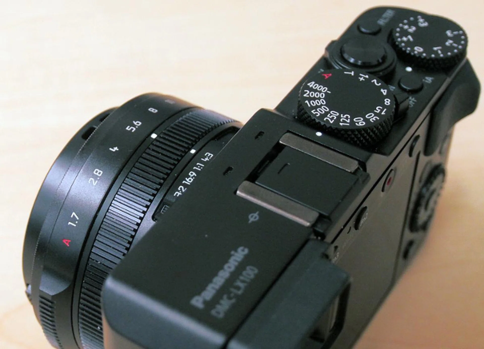 There's a dedicated shutter speed dial, another dial for exposure compensation and a ring on the lens to set aperture.