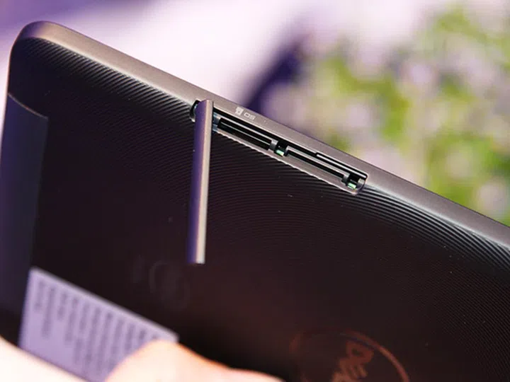 The micro-SD card slot is located at the side of the tablet and is hidden by a plastic flap that's easily removed. A second slot beside the micro-SD card is probably for the SIM card on LTE versions of the tablet.