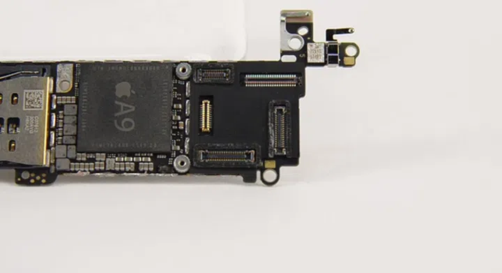 A silicone seal surrounds some parts within the iPhone SE's logic board connectors.