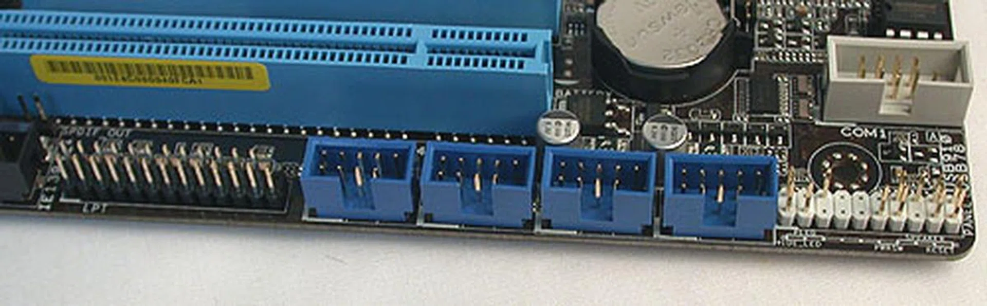 Some of the extra PCB space have been used to add more headers for USB, FireWire, COM and even LPT.