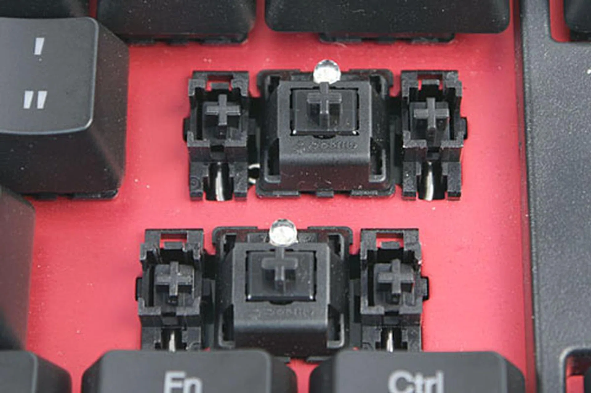 The keyboard that we received uses the Cherry MX Black switches. For elongated keys such as the spacebar, Shift and Enter keys, proxy switches are used on either side of the real key-switch to stabilize the key. You can also see where the LED is inserted.