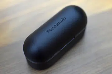The embossed logo on the charging case's lid is barely visible.