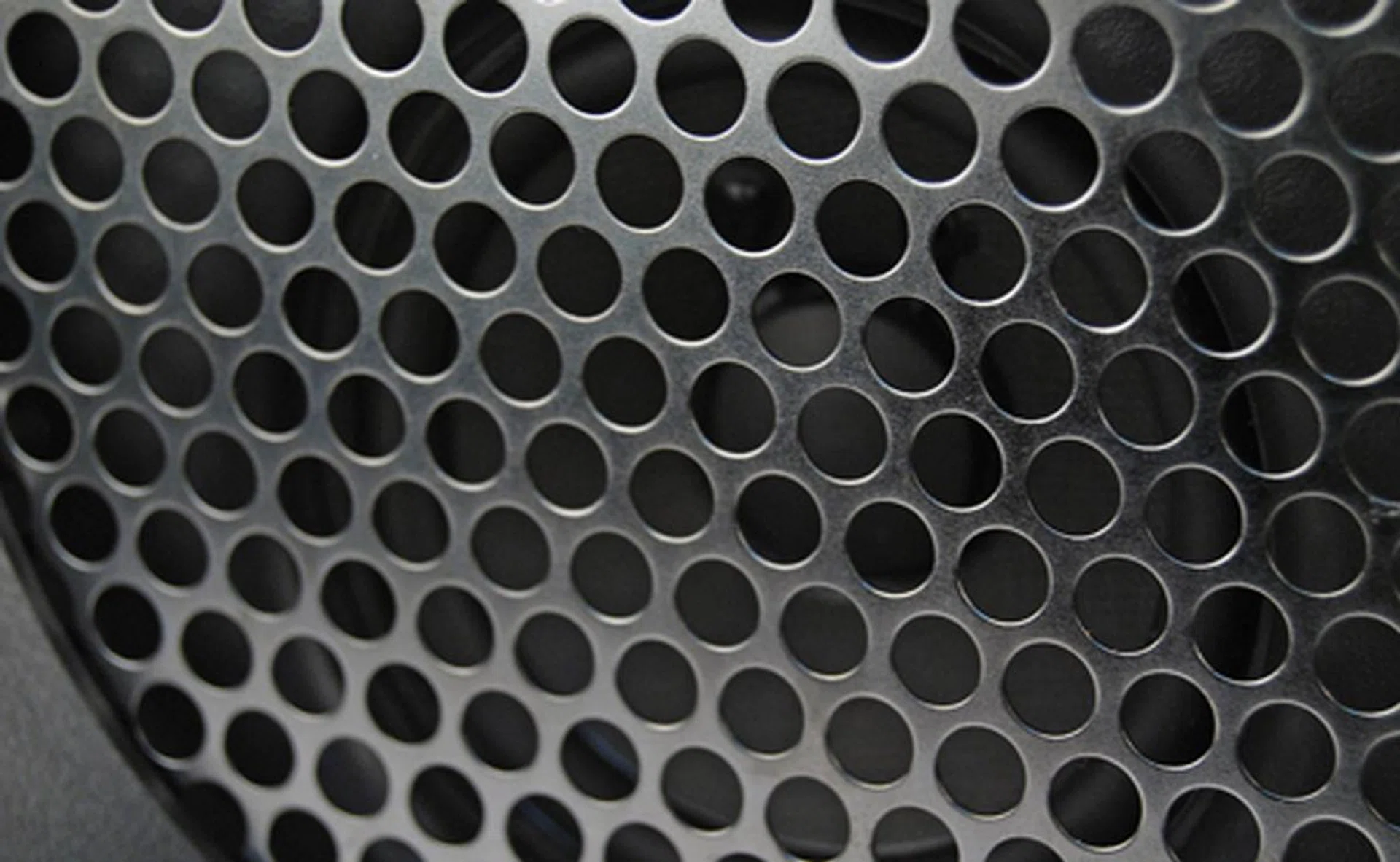 A finely constructed mesh covers the innards of the device.