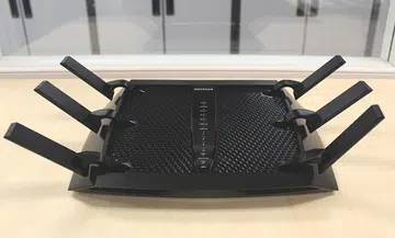 The Netgear Nighthawk X6 is huge, and with its antennas extended, looks like a six-legged crab.