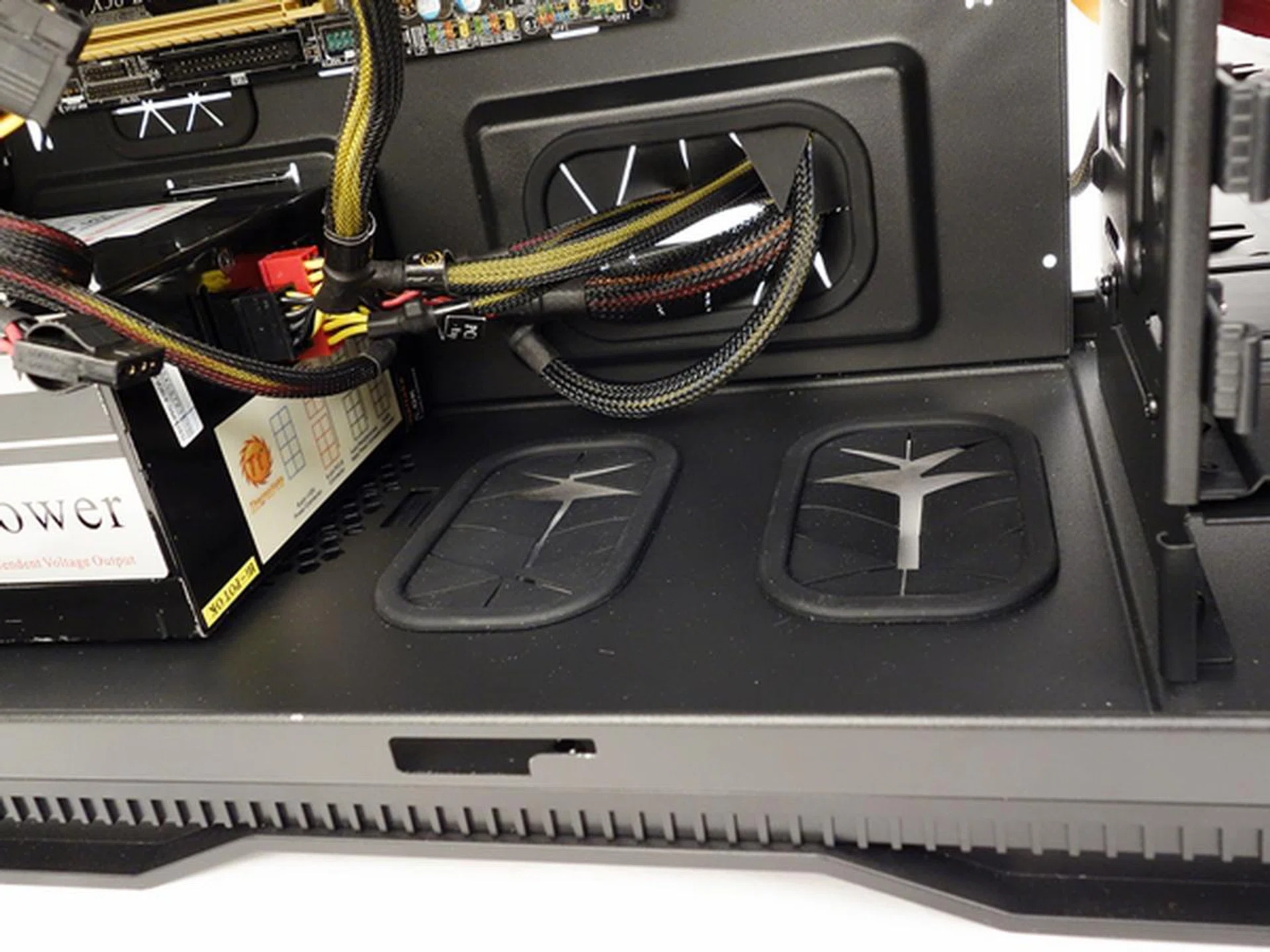 The case offers excellent cable management options and as you can see, it also has cut-outs to lead cables to an optional bottom-mounted Stacker HAF 915 unit.