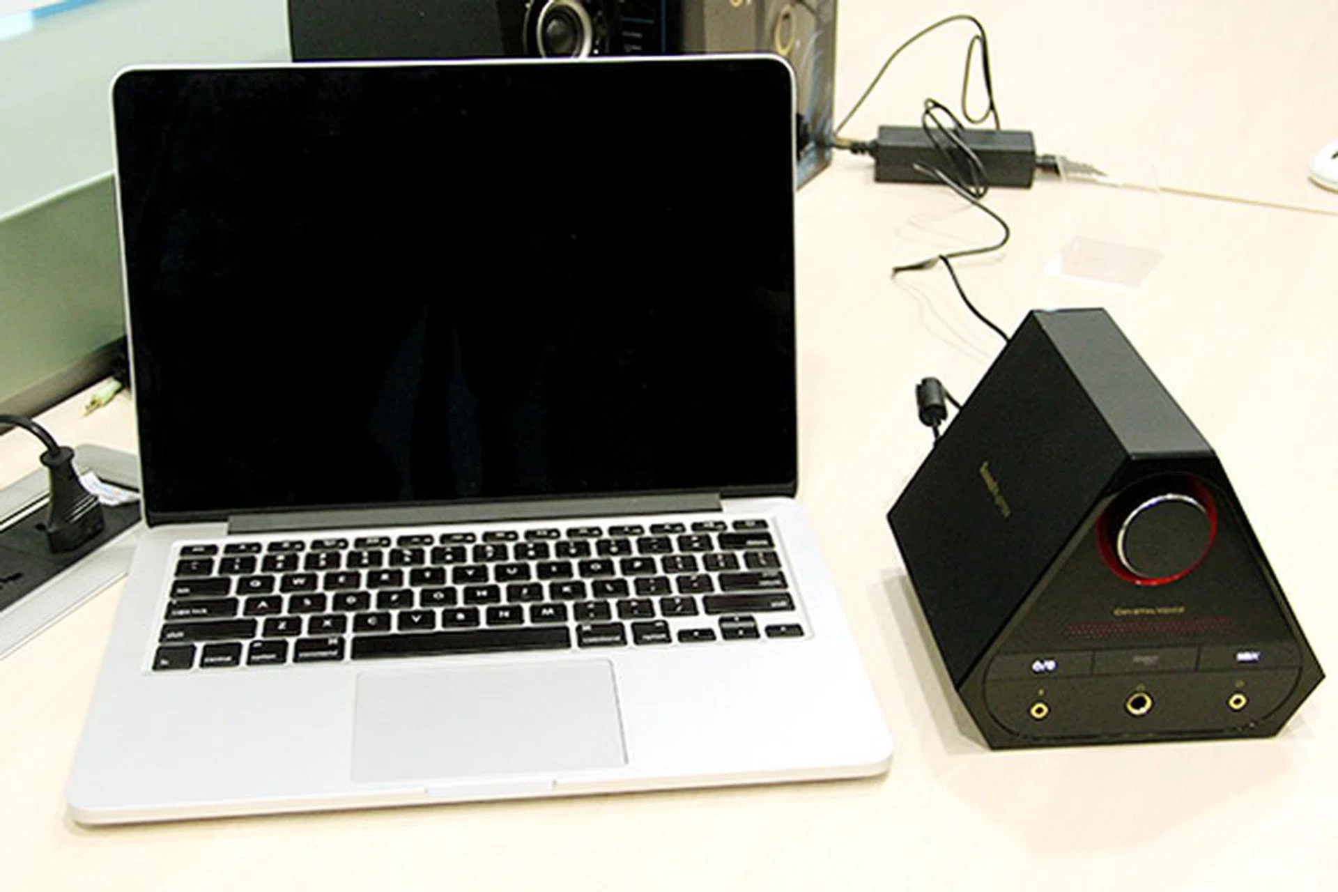 The Sound Blaster X7 compared to a 13-inch Macbook Pro – it kind of dwarfs the notebook!