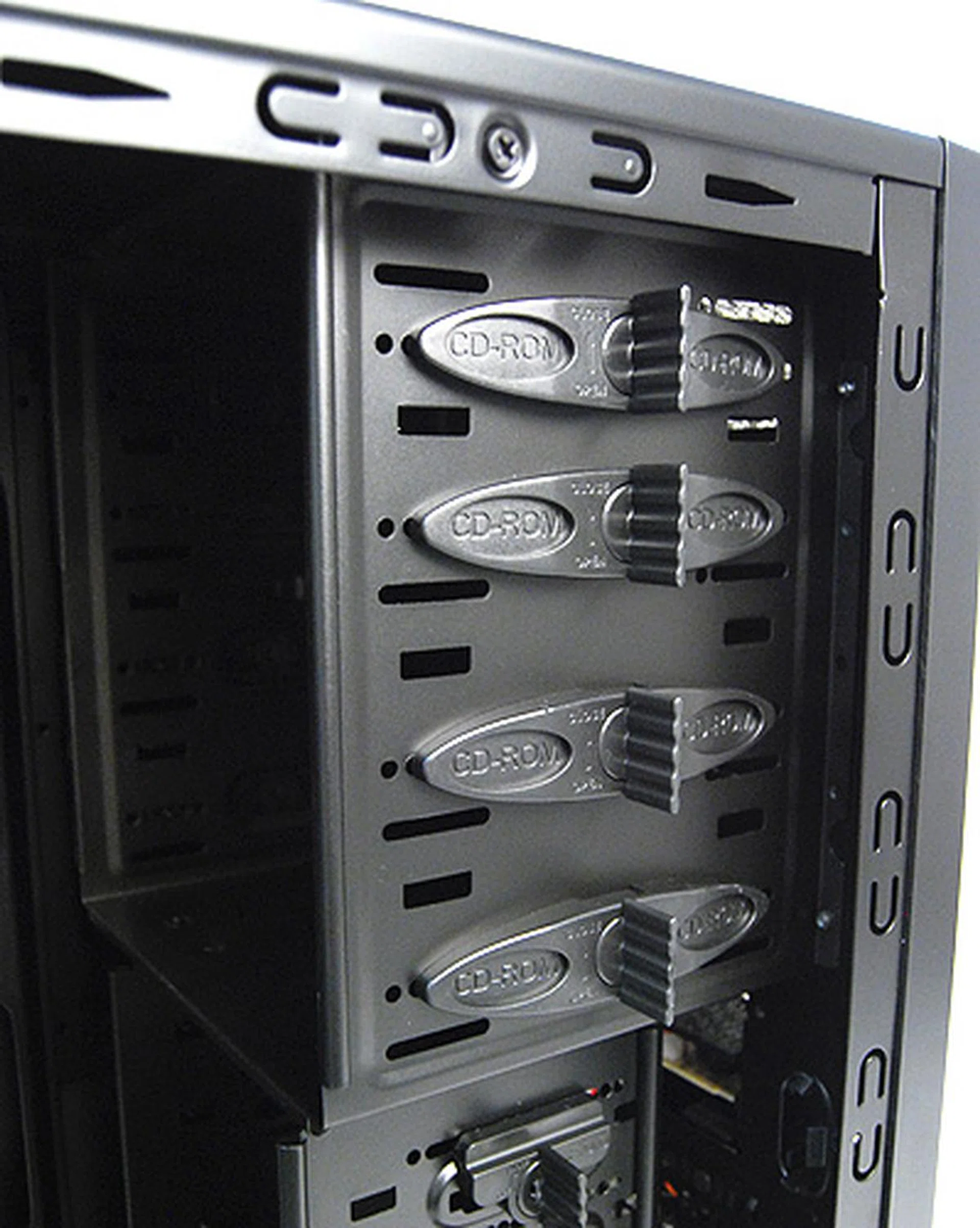 Installing optical drives is a tool-free affair, simply detach the securing clips at the sides, slide the drive in and reattach the clips to secure.