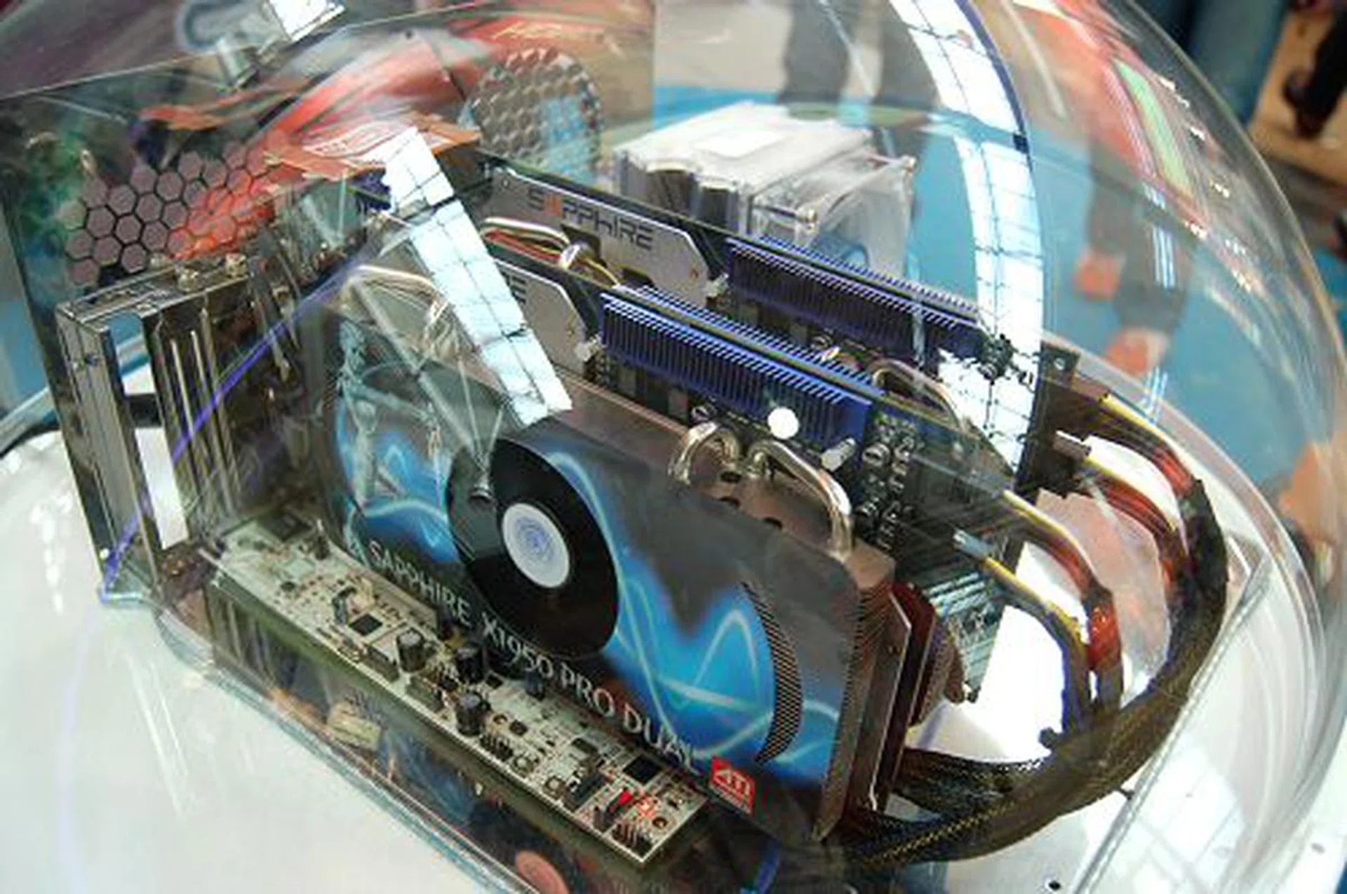 The main highlight over at Sapphire's booth is a CrossFire system running a pair of dual Radeon X1950 graphics cards. That's right, each card has a pair of Radeon X1950 GPUs which are internally CrossFire'ed. So this is a 'quad-CrossFire' system.  