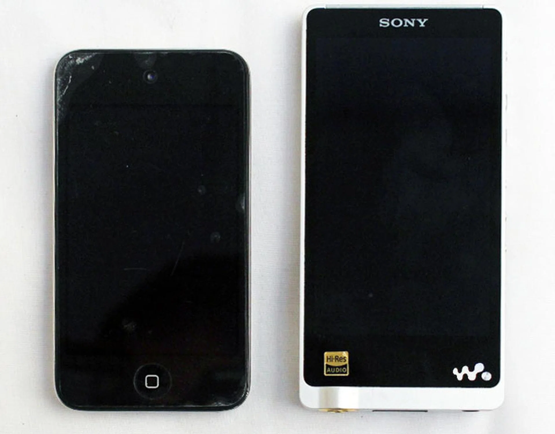 The NWZ-ZX1 (right) side by side with a 4th-gen iPod Touch.