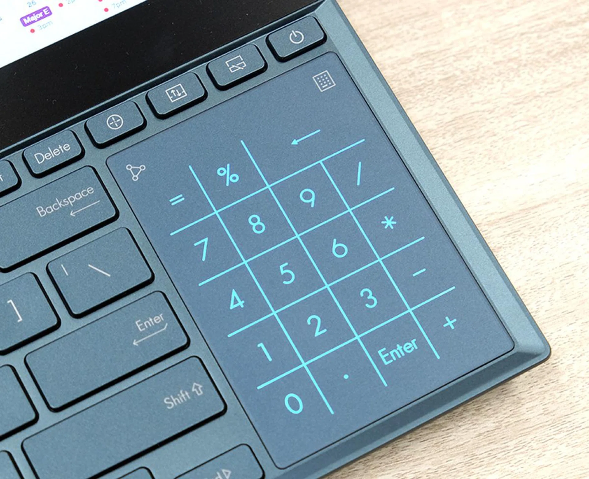 The trackpad is tiny and it also works as a virtual NumberPad.