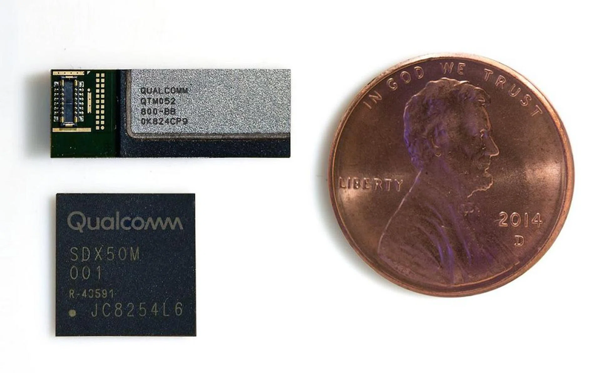 The QTM052 mmWave antenna module along with the Snapdragon X50 5G modem juxtaposed against a one penny coin.