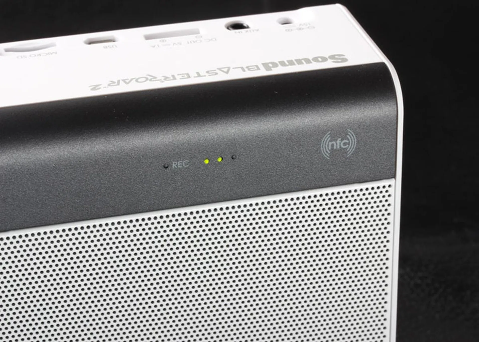 The NFC point is on the right of the speaker.