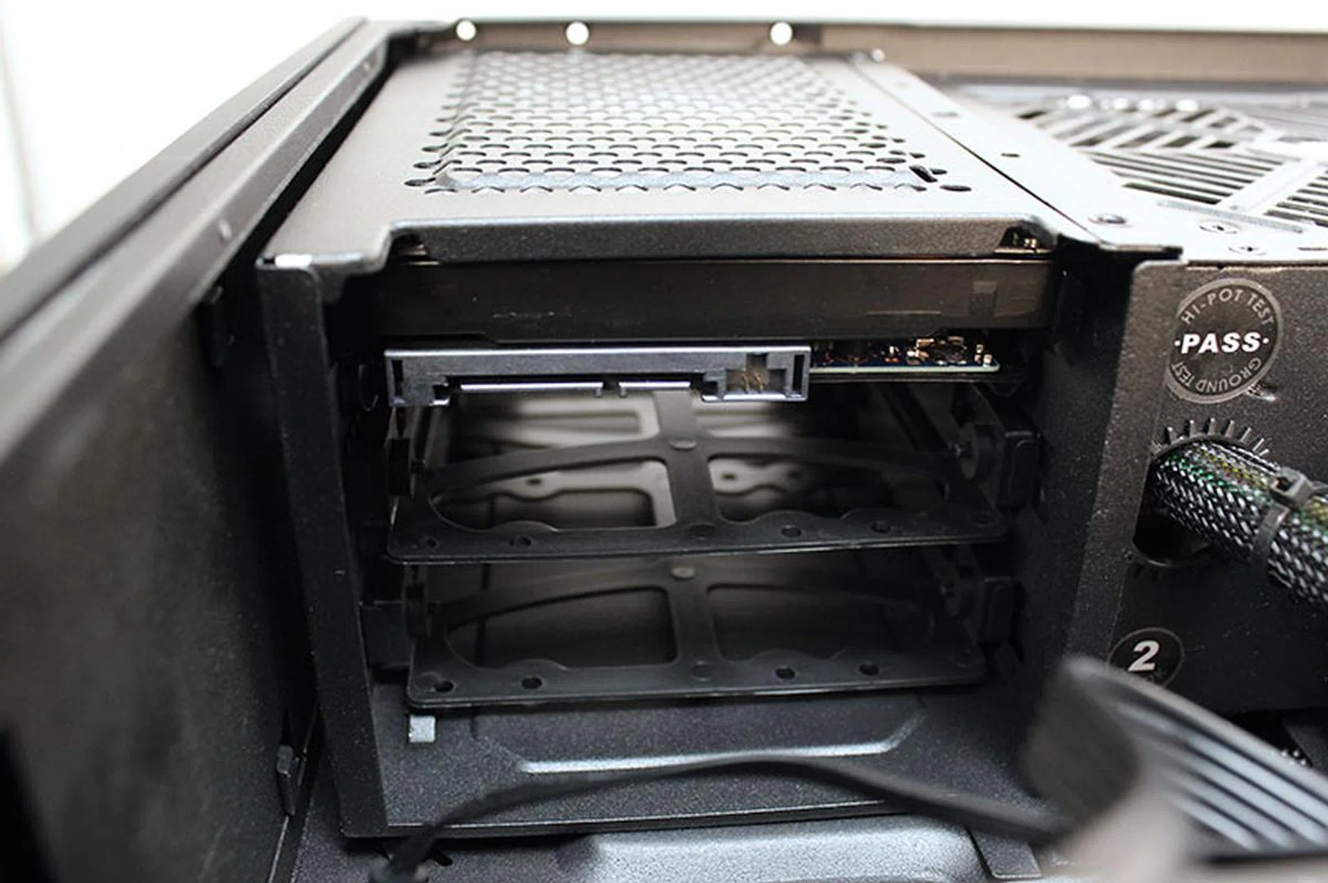 The 2TB Toshiba hard drive is located above the power supply unit.