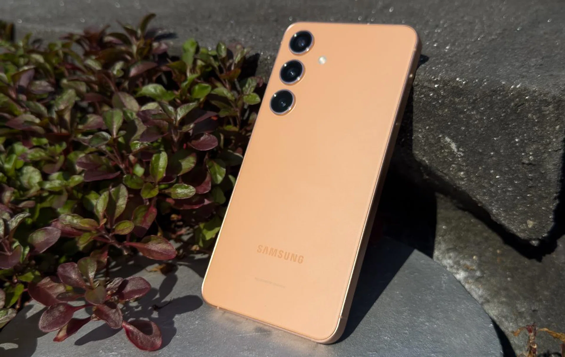 The Samsung Galaxy S24 in Sandstone Orange colourway.