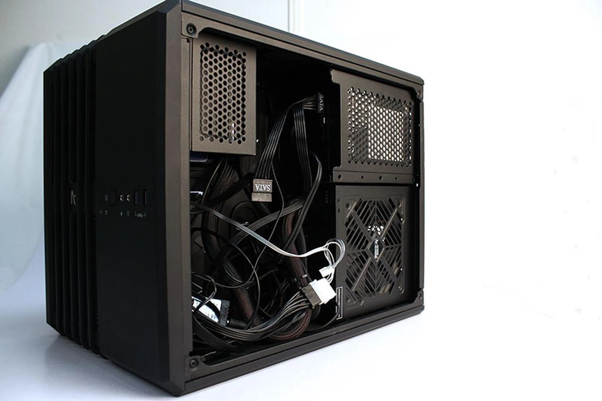 The tangle of cables are hidden in the rear chamber.