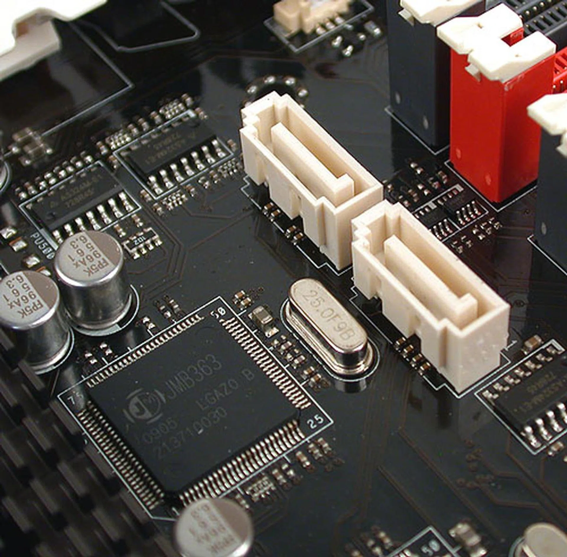 Here's one of the two JMicron JMB363 controllers on the ASUS positioned beside two SATA ports meant for your SATA optical drives (since these two do not have RAID support) or even for hard drives if you do not need RAID.