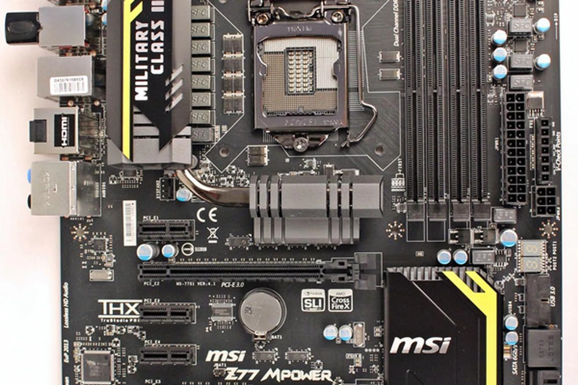The MSI Z77 MPower board sports a rather muted color scheme. Set against a black PCB, with free flashes of yellow stripes to break its dark monotony, it belies the true prowess of the board, its OC Certified capabilities.