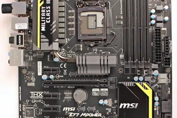 The MSI Z77 MPower board sports a rather muted color scheme. Set against a black PCB, with free flashes of yellow stripes to break its dark monotony, it belies the true prowess of the board, its OC Certified capabilities.
