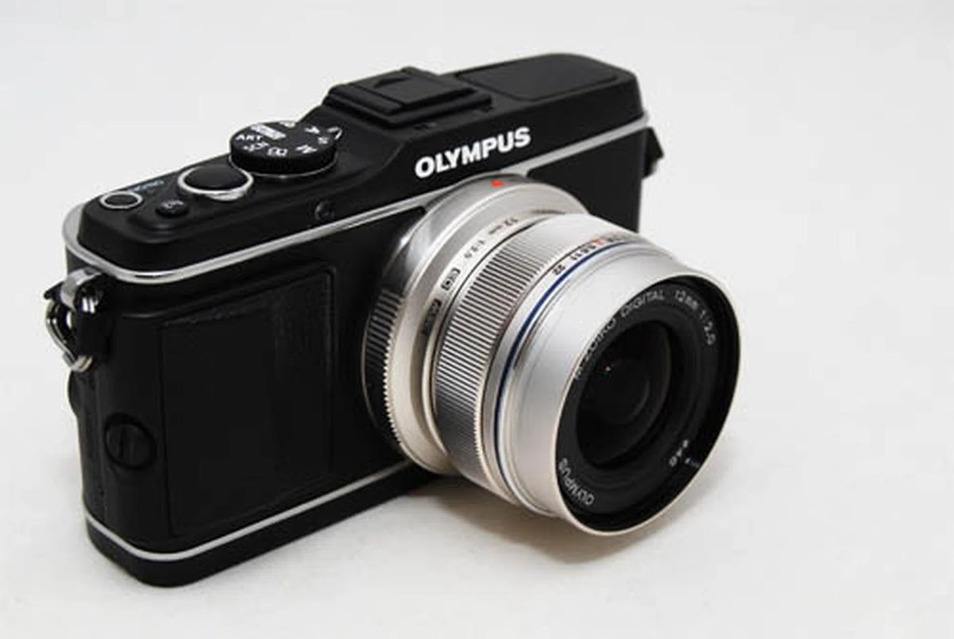 The 12mm f/2 doesn't add a lot of size and weight when attached to an MFT camera, like the Olympus E-P3 pictured here.
