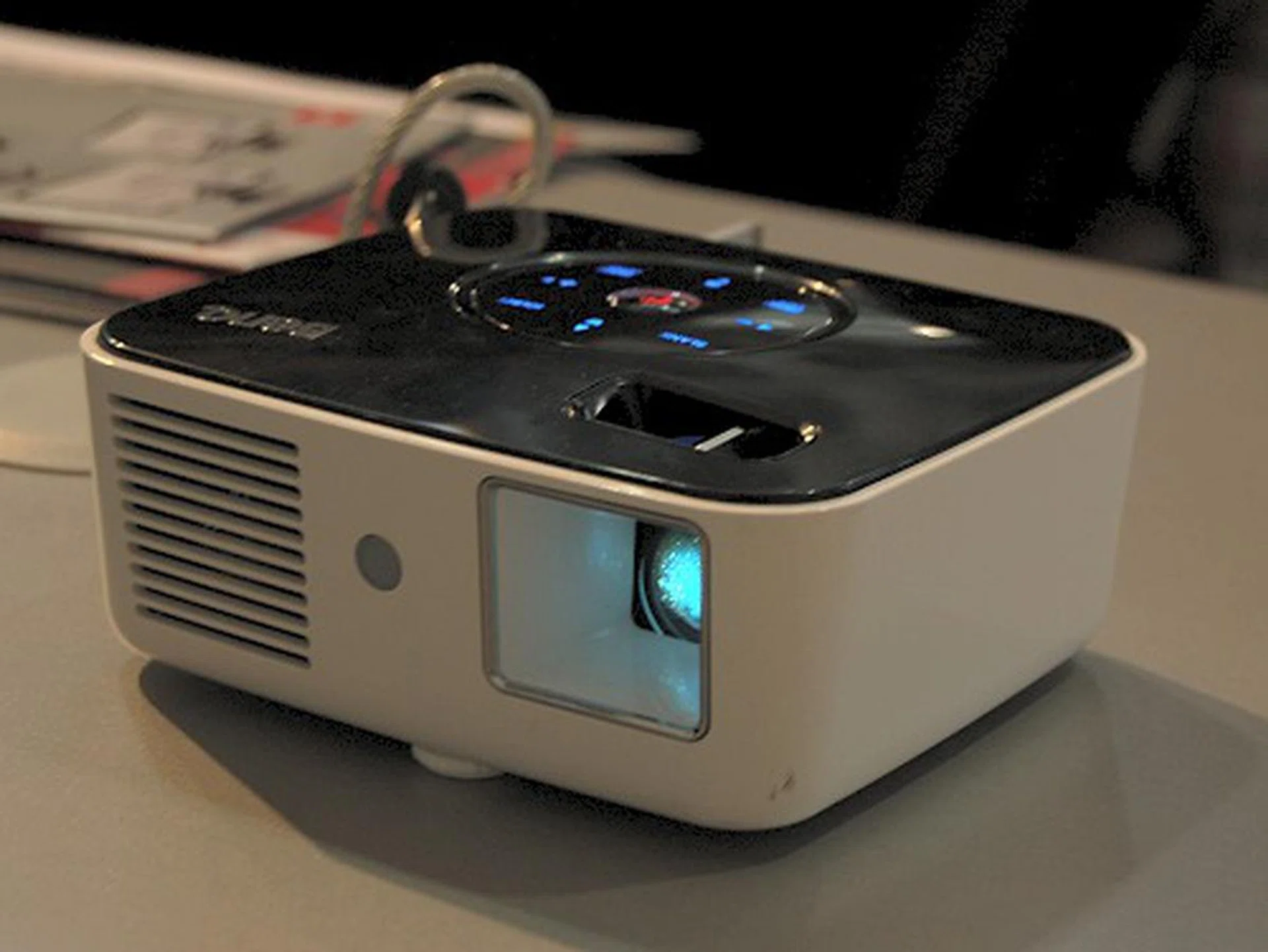  It has a 1000:1 contrast ratio, 100 lumens brightness, supports a resolution output of 858 x 600 (SVGA), weighs 640 grams with a dimensions of 136 x 120 x 54 mm. It uses DLP LED technology for its projection. Available in April 2009.  