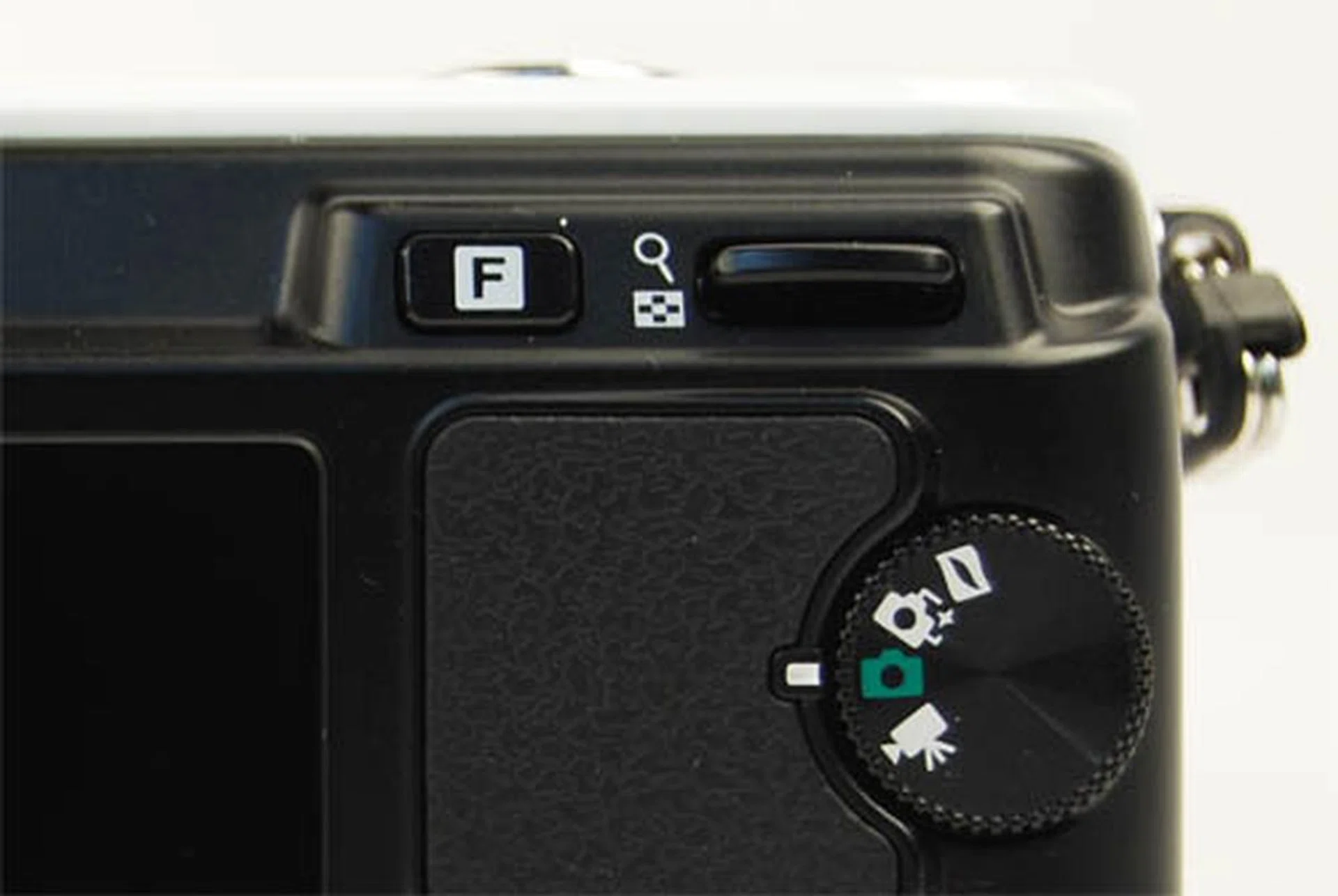 This toggle works to control aperture or shutter speed in the respective priority mode. It works, but is slower than the conventional control dial found on DSLR cameras.