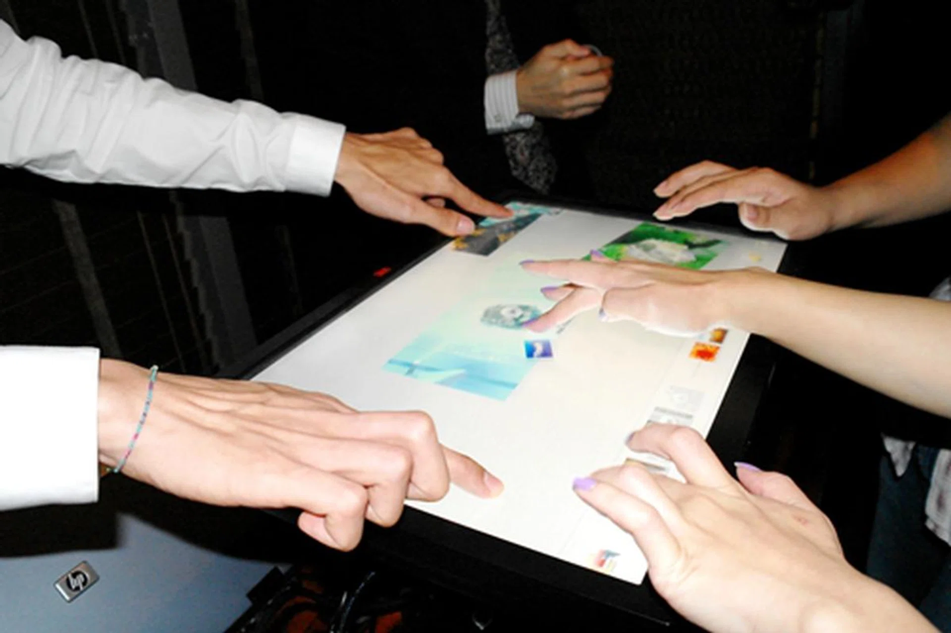 The M2256PW is compatible with Windows 7, which supports touch screen software such as the one seen here that allows end-users to interact with their digital media on a deeper level. The media had their hands full with touching the display, which can handle more than 10 finger inputs.