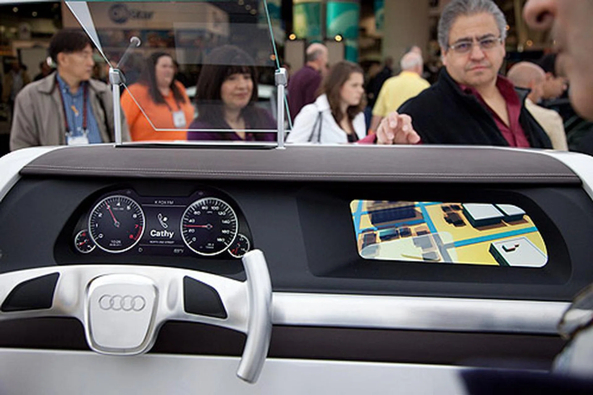 A concept Audi dashboard with a heads-up display (HUD) that projects road directions on your windscreen.