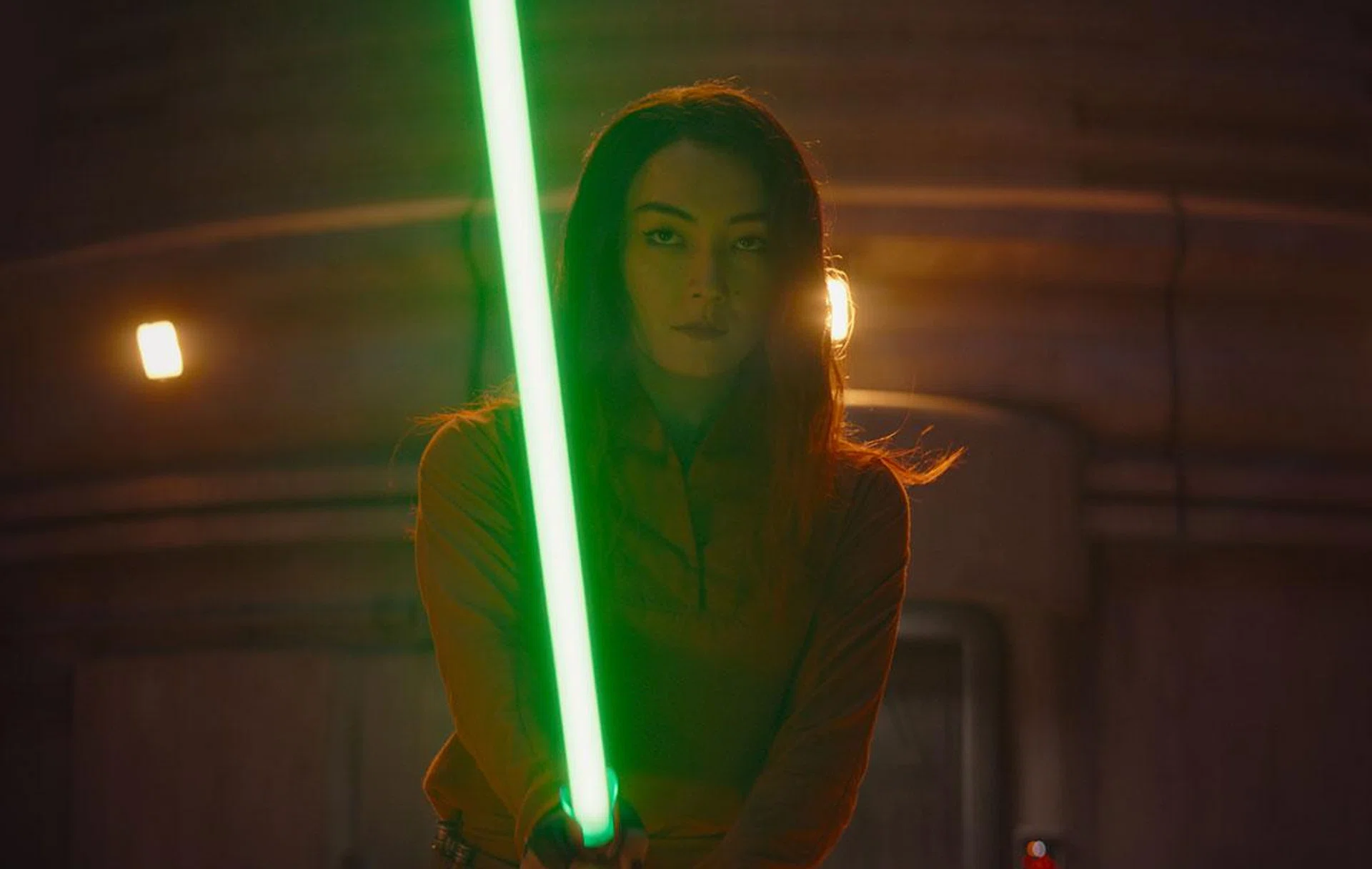 Sabine with Ezra's lightsaber. (Image Source: Disney+)