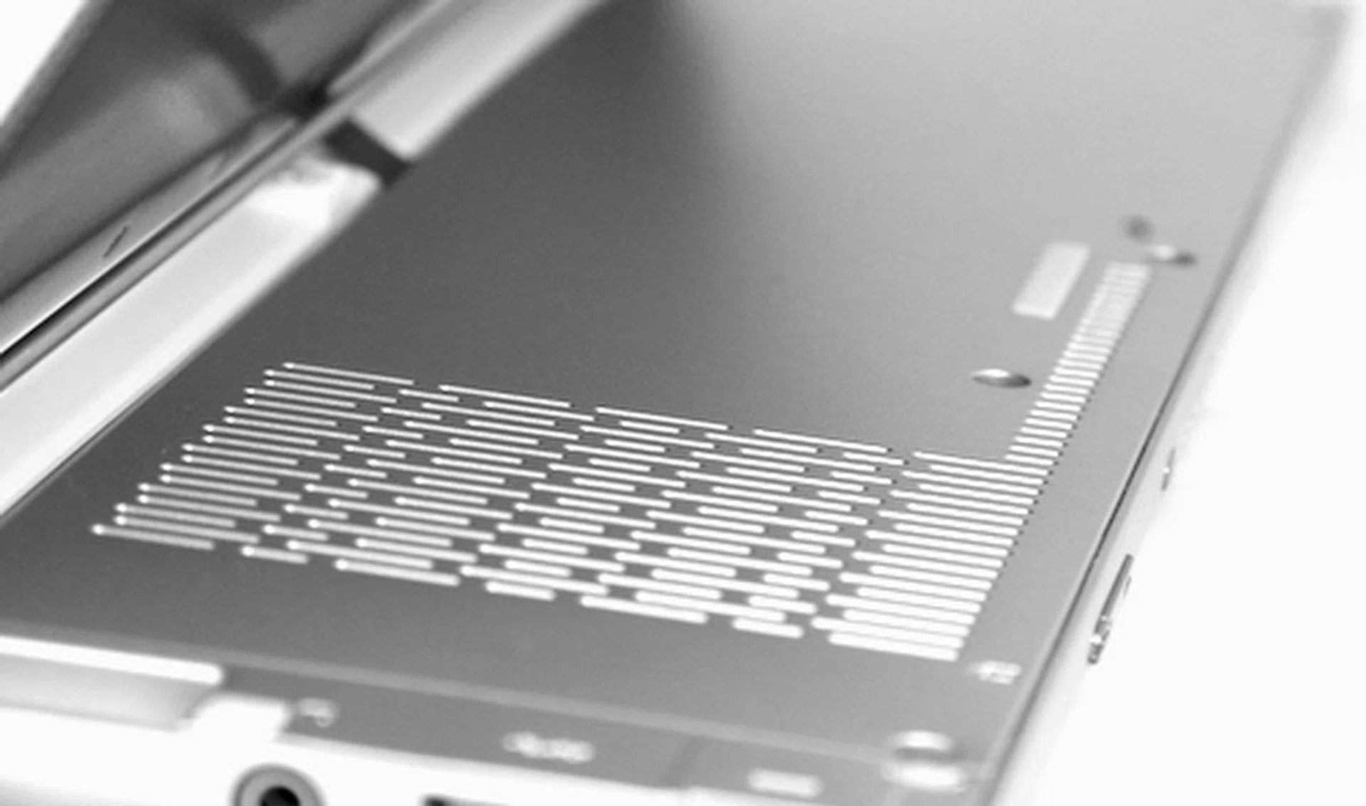 The back of the machine is also made of plastic, though it’s coated in metallic paint that lets it resemble the machined aluminum look of the bottom of the device. The grills that you see are the air vents of the machine.