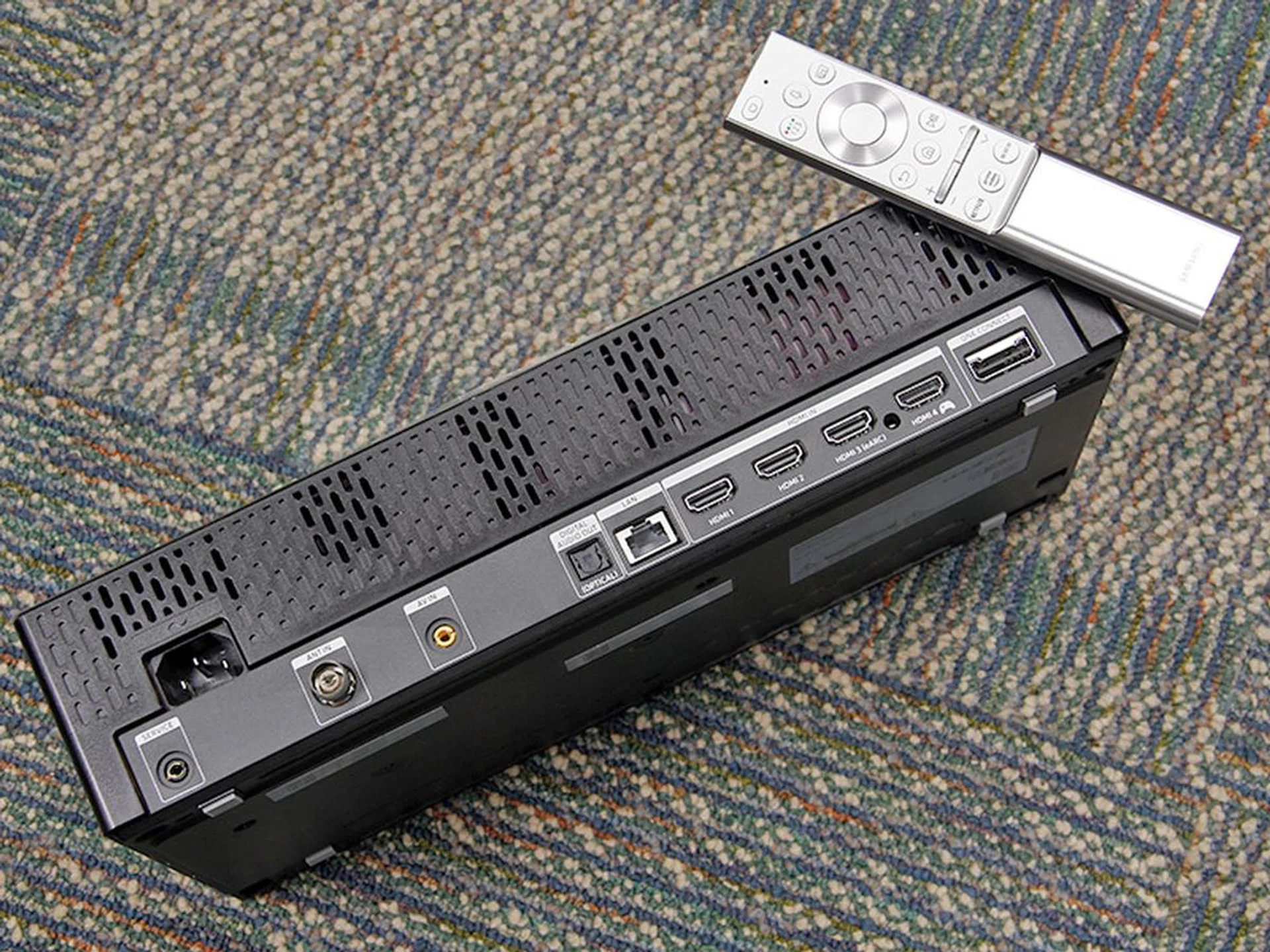 The Q950T doesn't have onboard I/Os — you need to connect your devices to the One Connect box. The benefit is that there's only one thin cable that goes from this box to the TV.