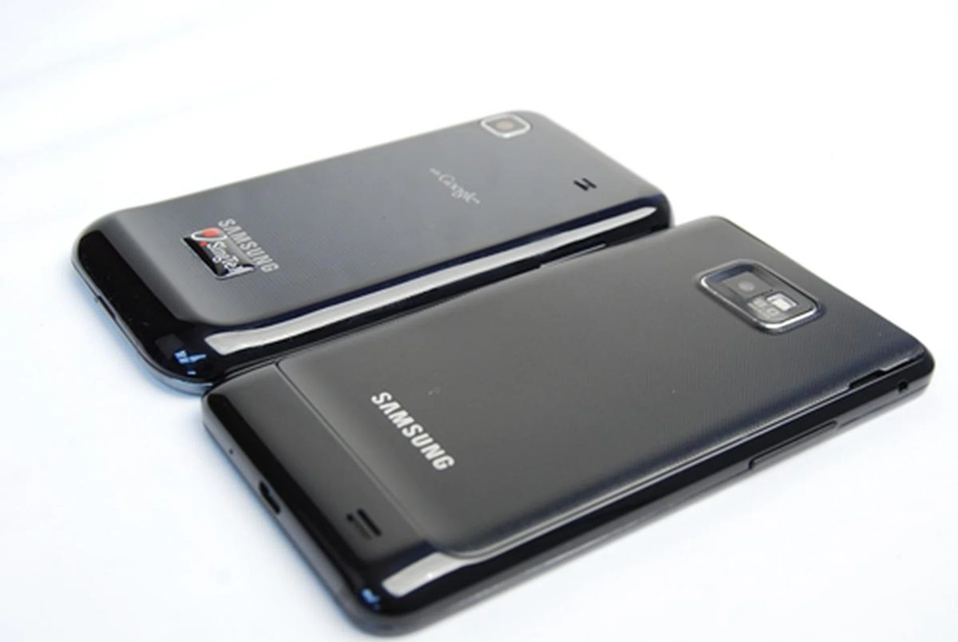 The textured back gives the new phone (in the photo's foreground) a better grip as compared to the rubbery surface on its predecessor (background).