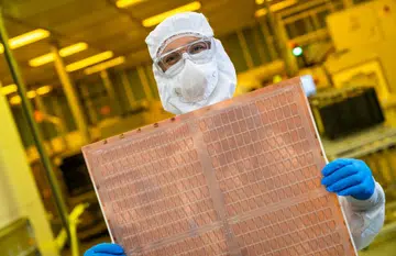 An Intel engineer holds a test glass core substrate panel at Intel's Assembly and Test Technology Development factories in Chandler, Arizona. (Source: Intel)