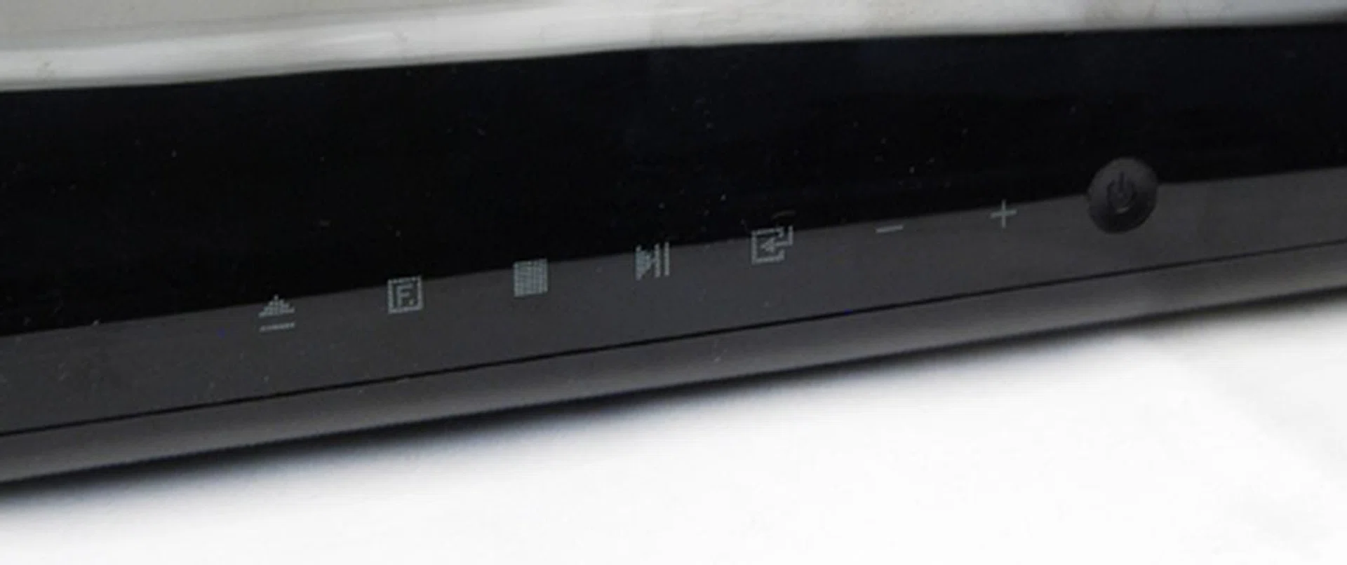 Soft touch button to control playback for the built-in Blu-ray player are present on the top face.