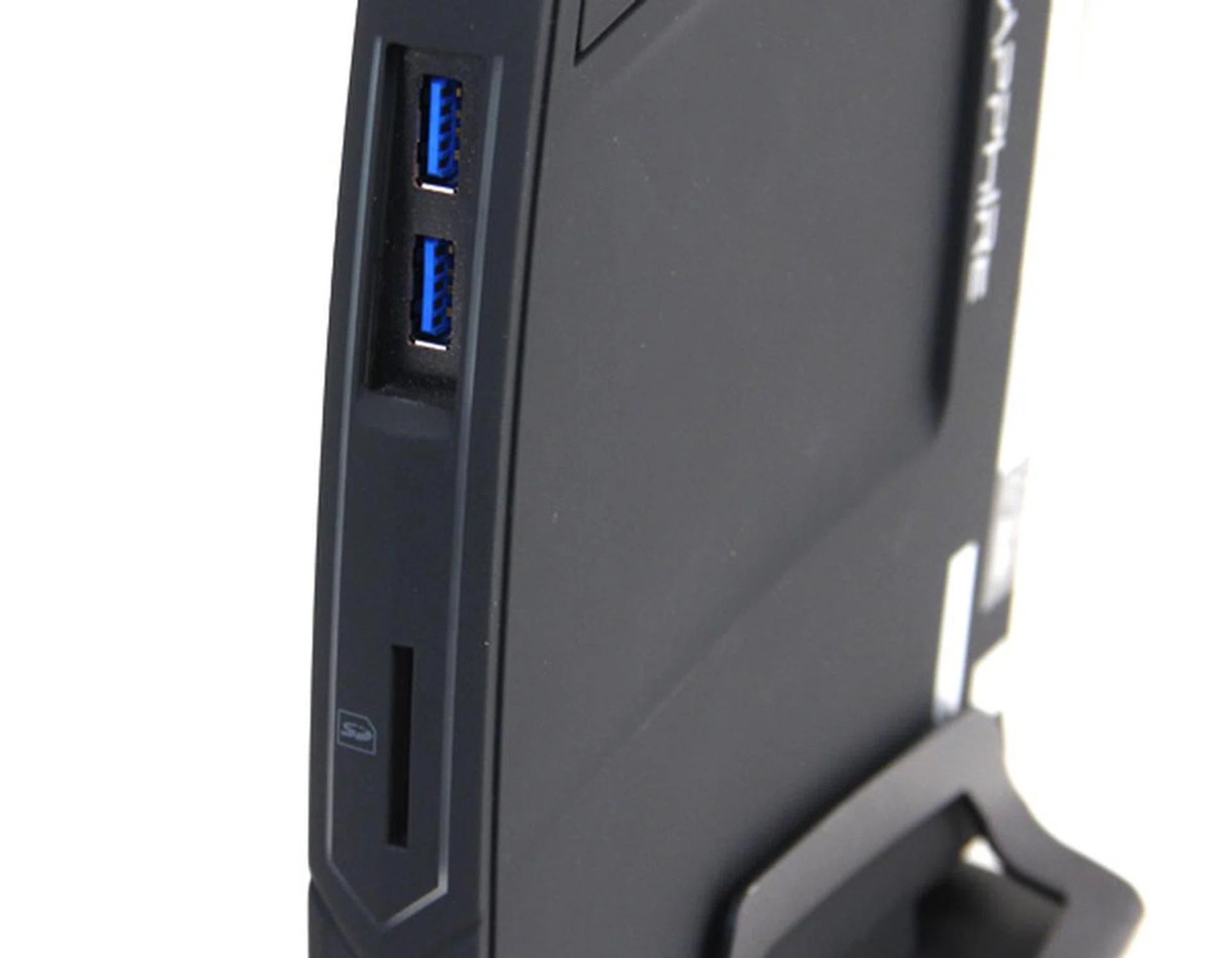 Up front, behind a dust cover, are two USB 3.0 ports. Below it is a SD card reader.