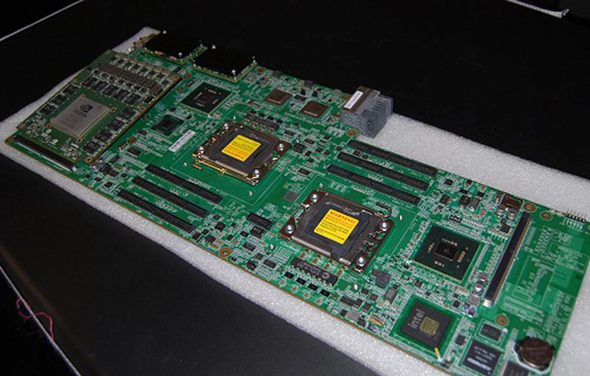 The Tesla module seen above belongs as part of one of the highest performing Tesla blade systems. This is the T-Platforms TB2-TL where each blade node as seen here has dual Intel quad-core Xeon L5630 processors, dual Tesla X2070 GPU modules and up to 24GB DDR3 main memory. The complete TB2-TL blade enclosure fully populated will have 192 quad-core processors, 192 Tesla GPUs, up to 384GB of main memory, 192GB of GPU memory, peak power of 105TFLOPS, weighs 154.6kg and consumes 12KW of power. Mind boggling for a 7U enclosure.