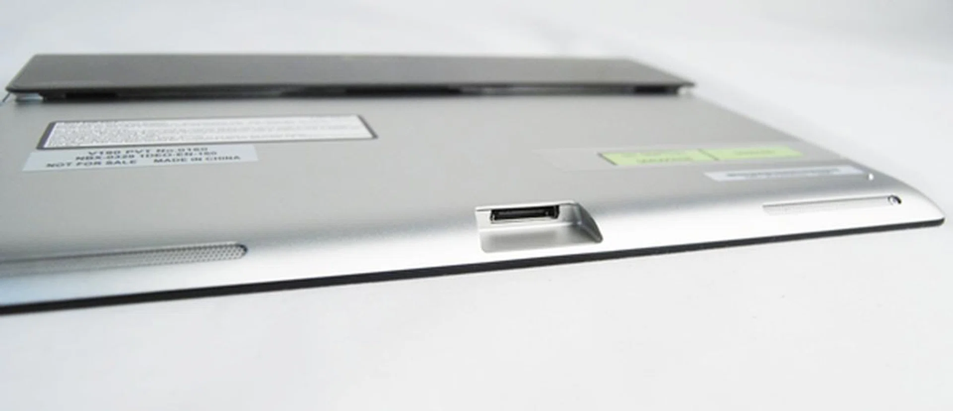 The Sony Xperia Tablet S unfortunately doesn't use a more universal microUSB port and instead requires users to rely on a proprietary port for charging and data transfer on-the-go. Note the two speakers that flank the proprietary port.