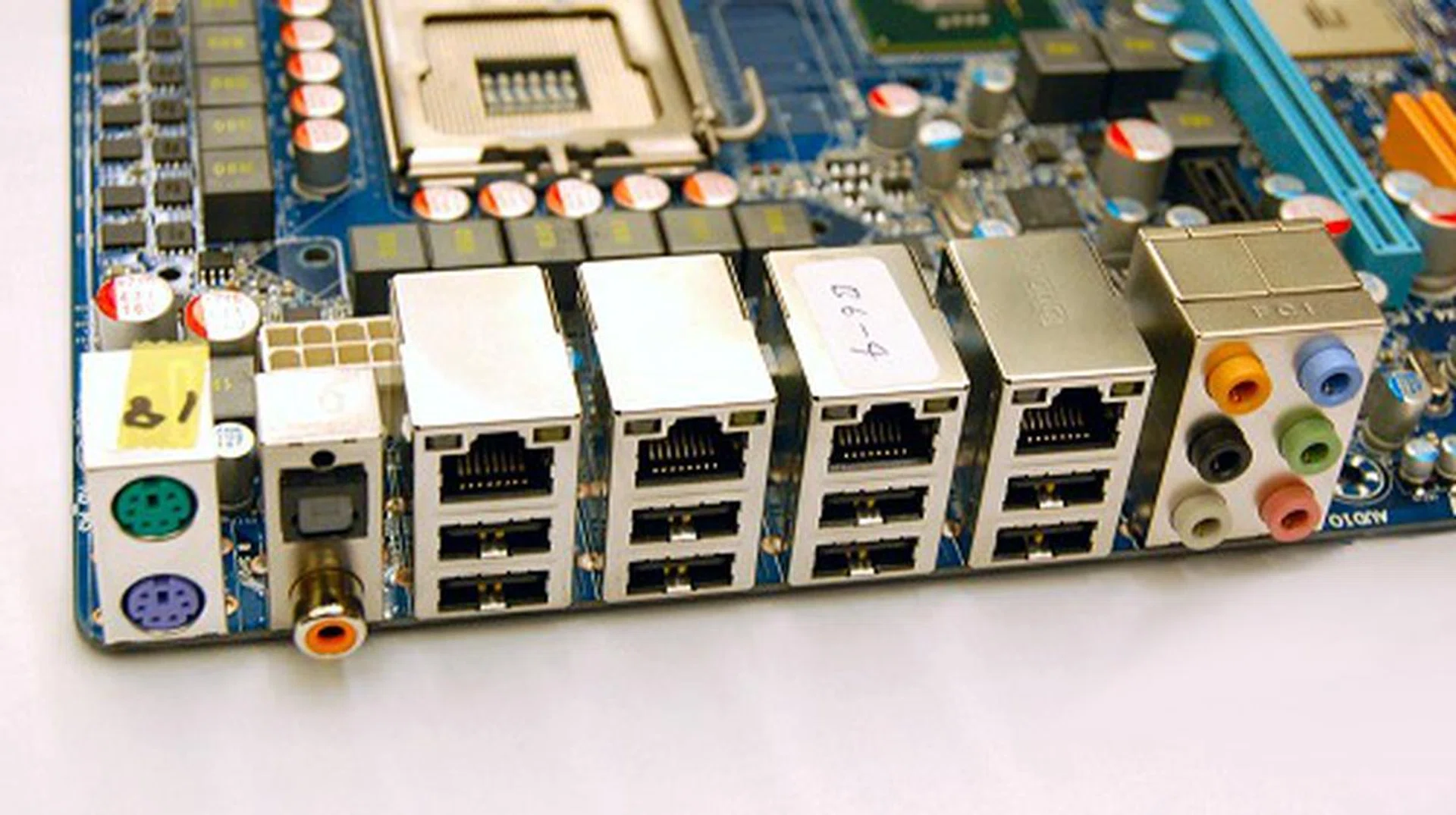 The first clue of this board's power and class is revealed on its rear-I/O panel where you'll find an impressive array of four Gigabit Ethernet ports, eight USB 2.0 ports and other usual accompanying ports. FireWire support is still available on the board, but that's been moved to the dedicated brackets to make way for the onboard 'router'. Serial and Parallel ports have long been abolished, but PS/2 ports still linger on for those of us still holding on to our older tried and trusted keyboard/mouse combos.