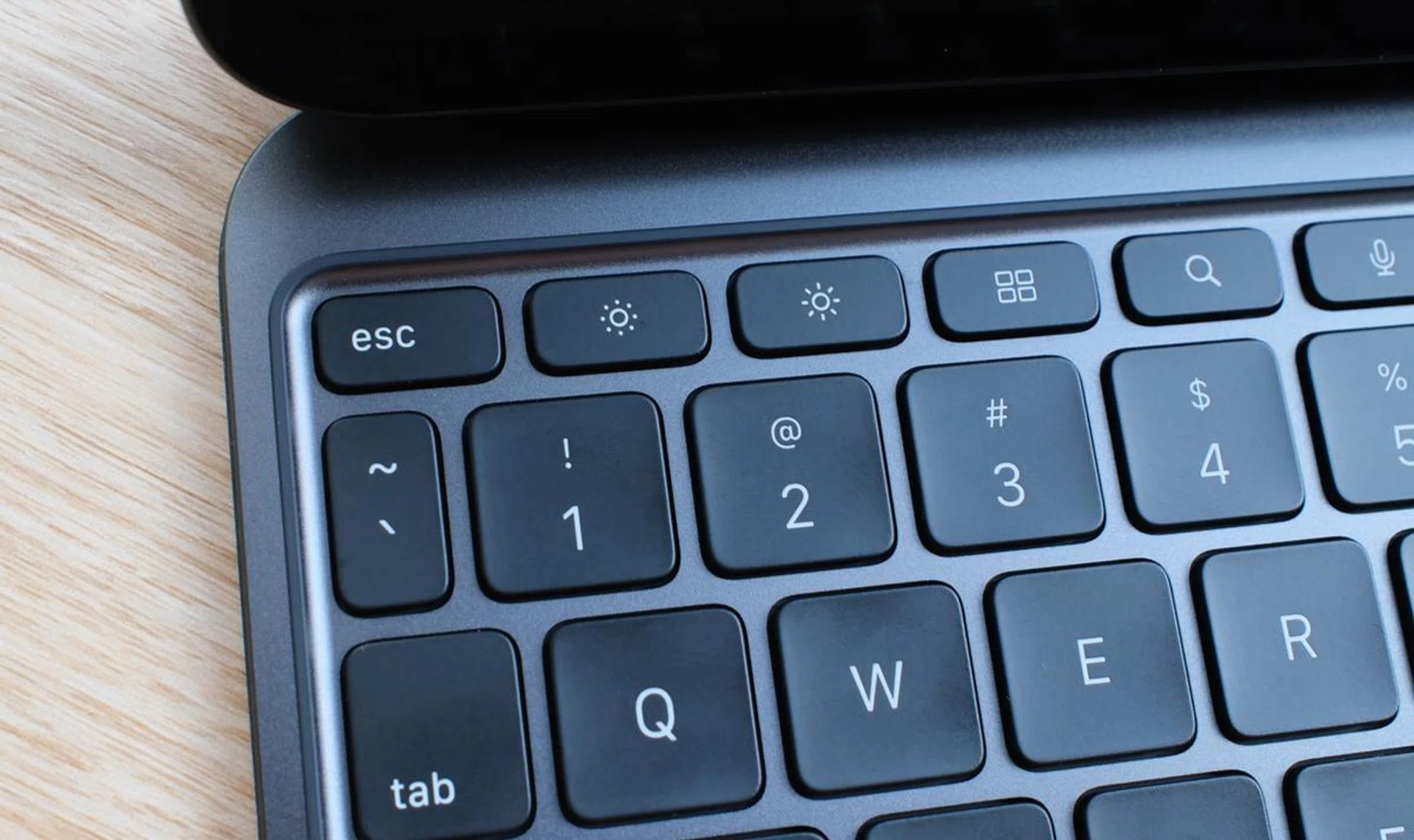The function row is super handy because it has an "Esc" key and shortcuts for things like screen brightness, media playback, and volume control.