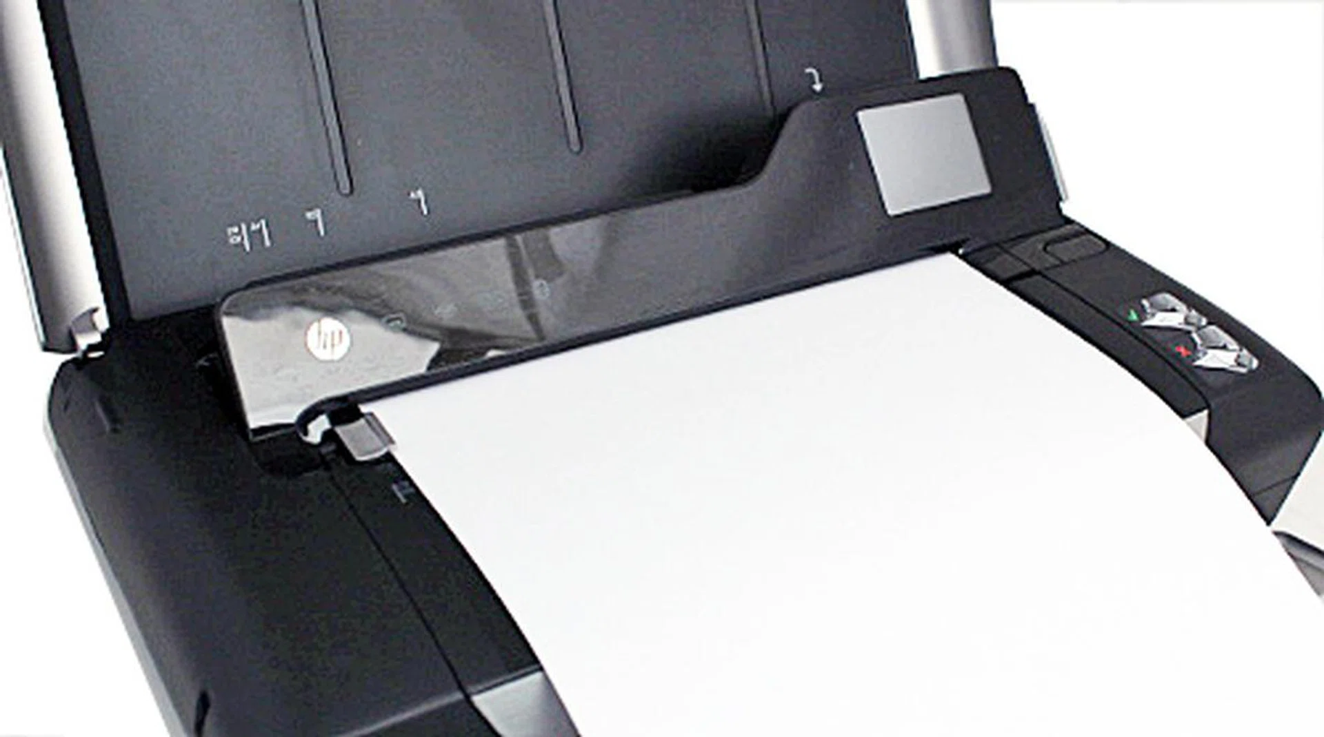 In order to copy or scan, you will have to feed each page through the slot beneath the control panel. 