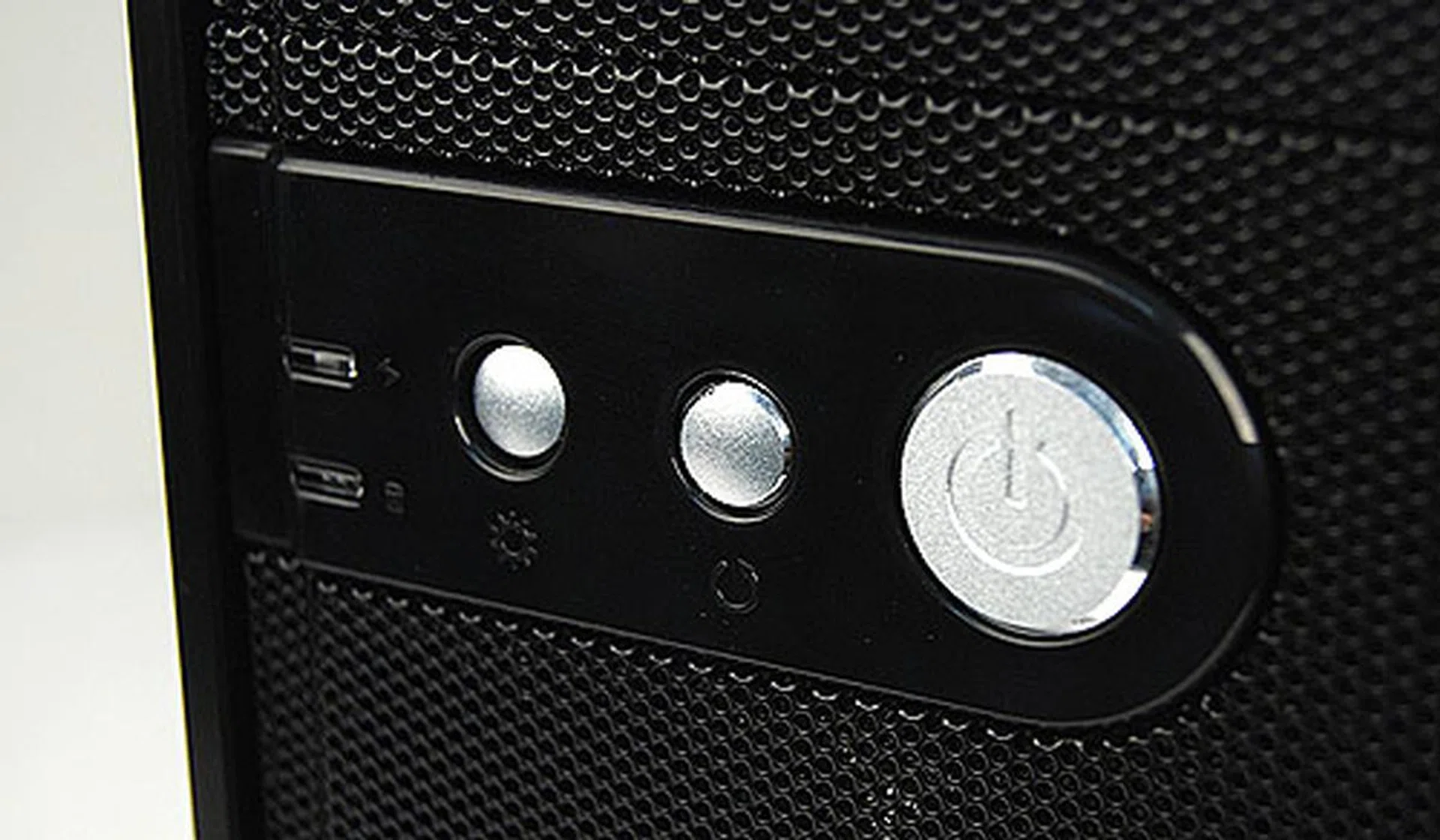 The Power and Reset buttons are located further down. The left most button allow users to turn on and off the LED lights on the front intake fan.