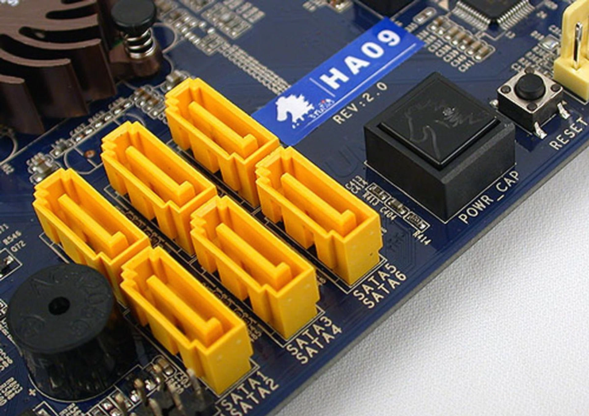 We can't rant enough about the placement of these SATA ports and the power and reset buttons next to them. With a dual-slot card, only two of the SATA ports are usable while the power button is completely hidden underneath our graphics card. This is a severe oversight of the design team despite all the other nice features of the board.