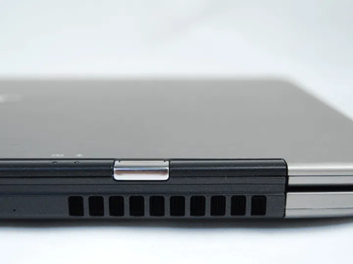 On the right of the machine lies the vent for dispersing heat away from you, which is a good thing when you have it on your lap.