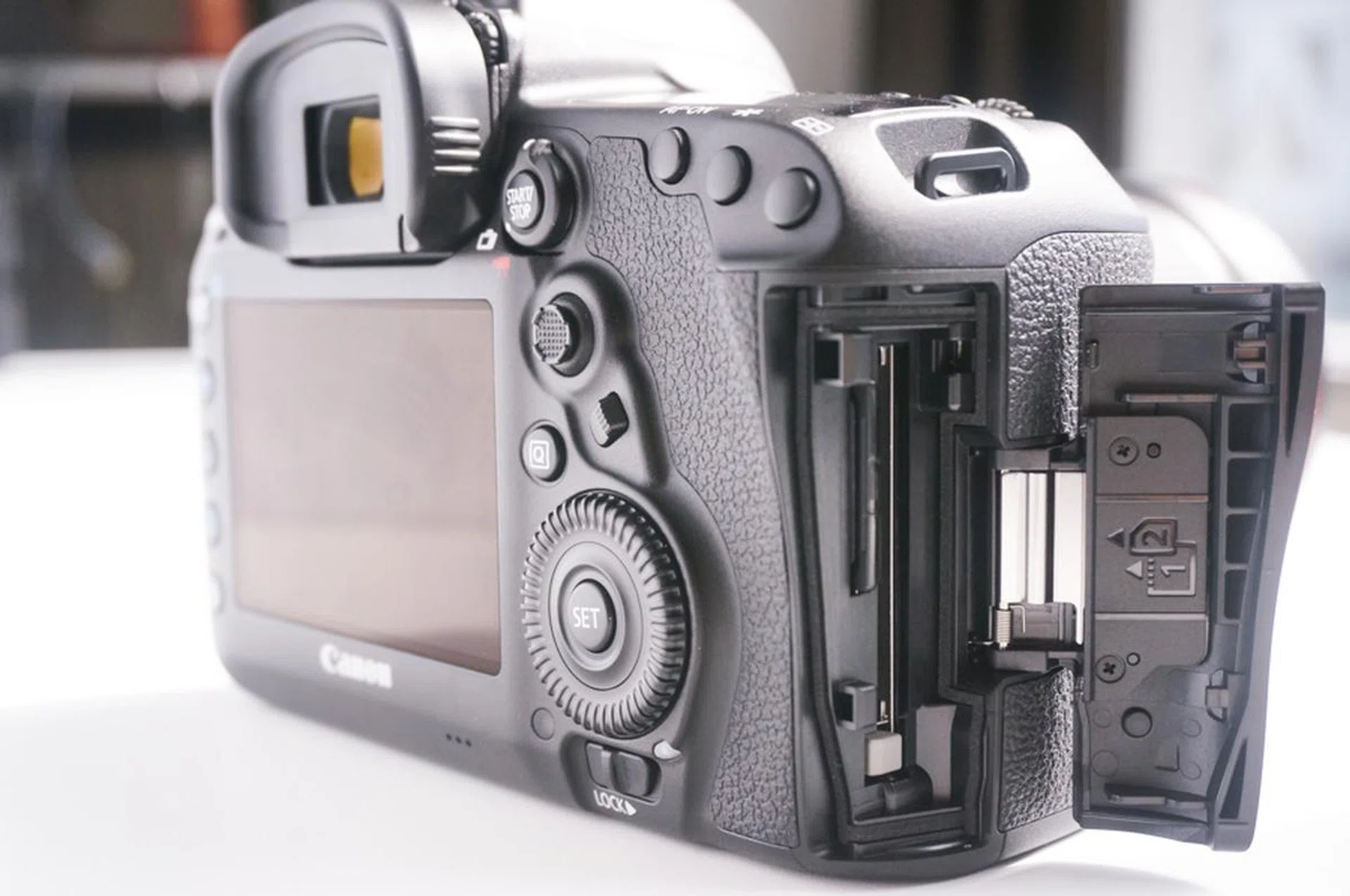 Dual card slots will allow for better flexibility. Note also the new focus point selector and focus mode lever. 