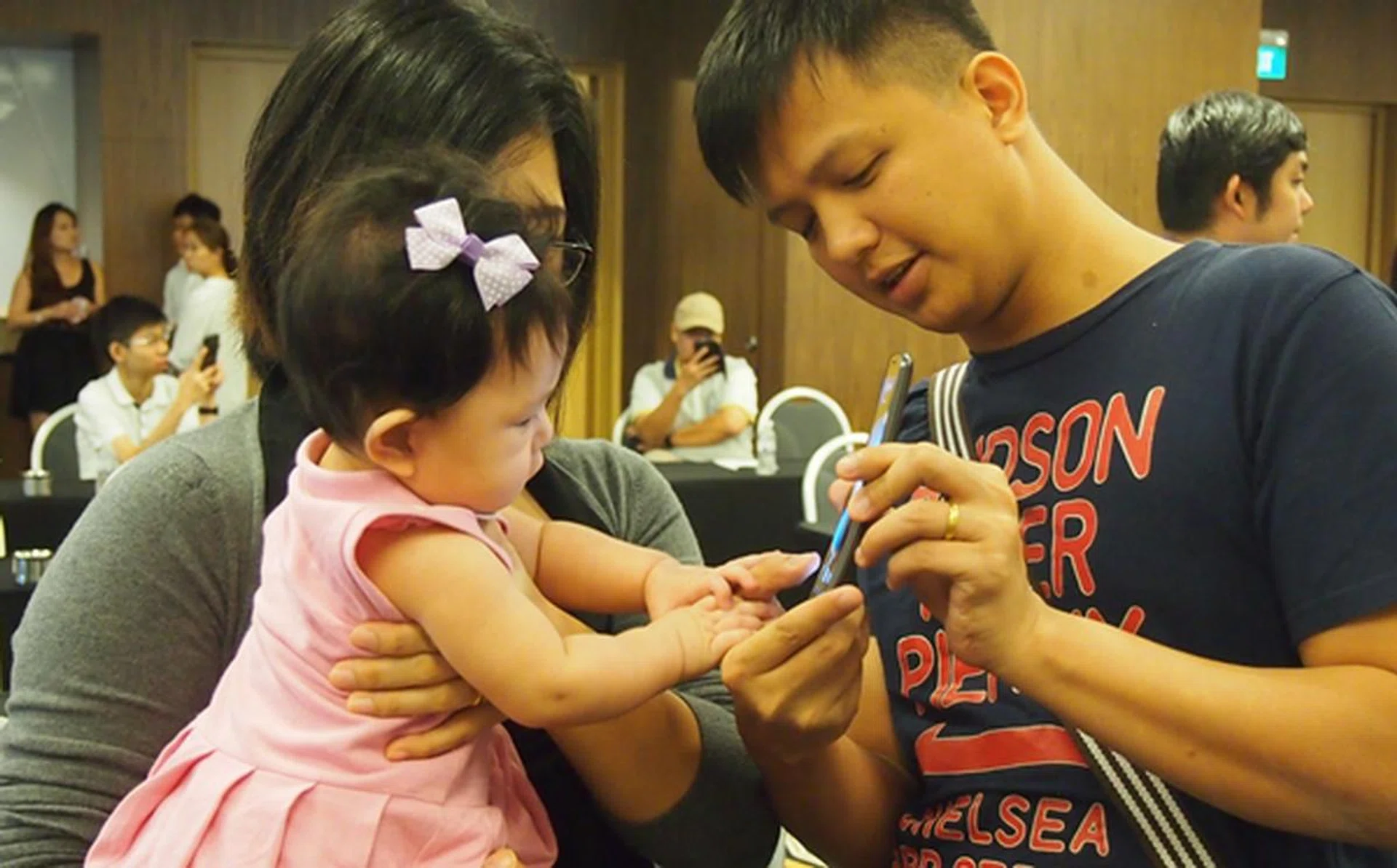 The LG G Flex was so intriguing that it attracted the attention of a baby girl.