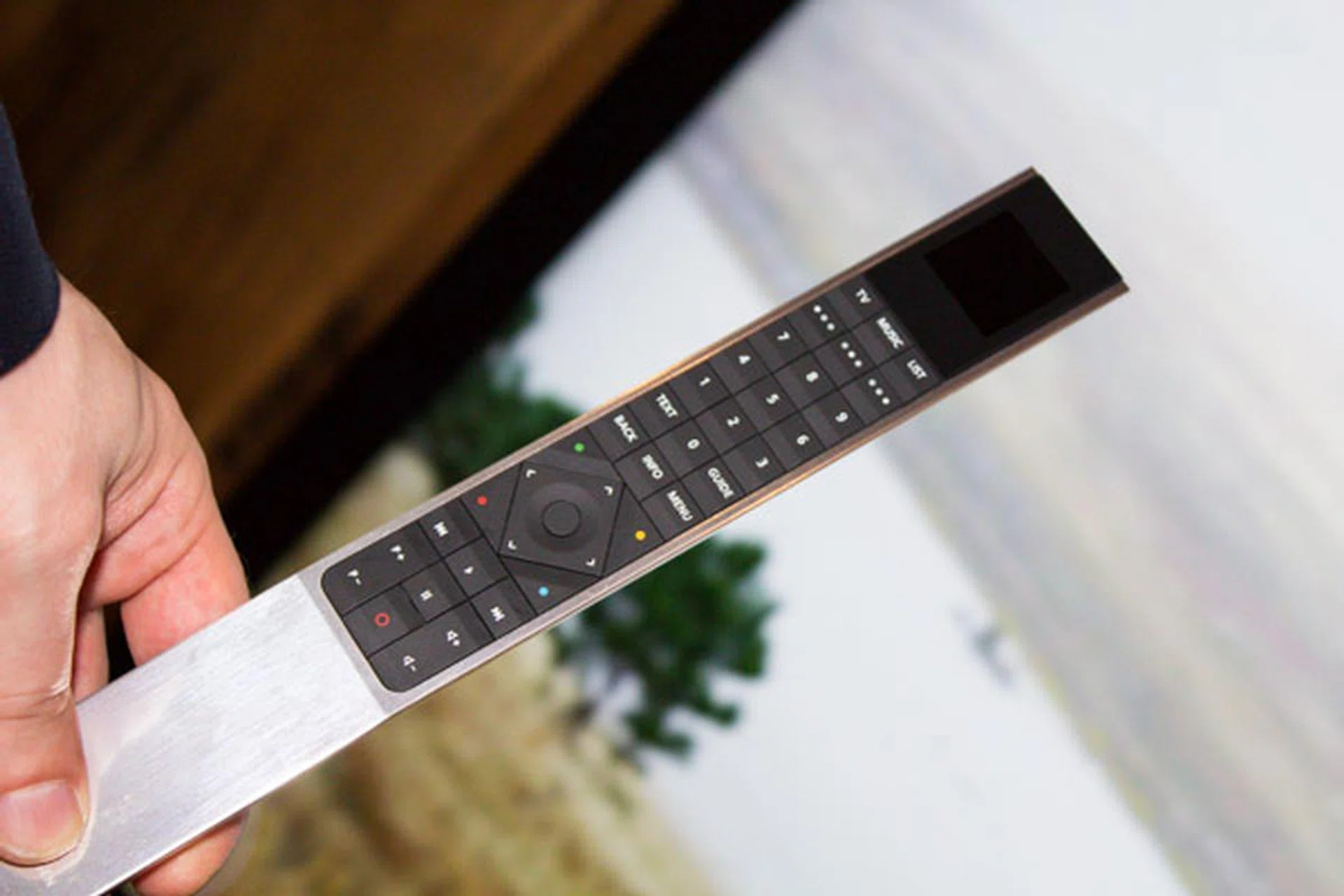The stylish BeoRemote One features three quick preset buttons at the top, allowing for easy switching of settings.