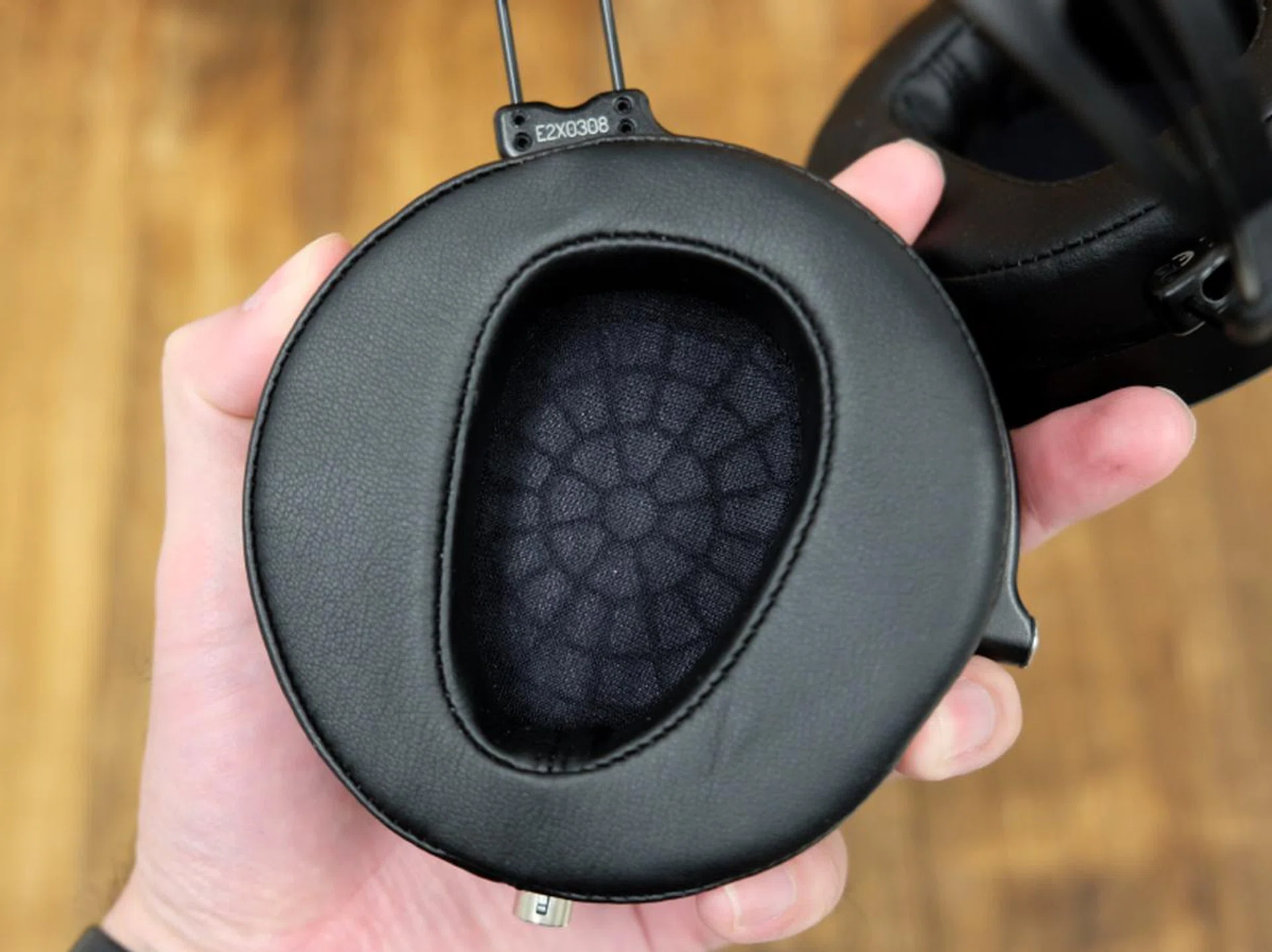 The ear pads have cut outs that are shaped to fit most ears.