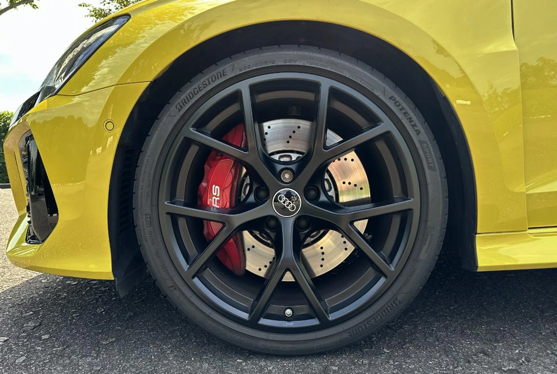 The front tyres are wider than the rear to maximise front-end grip. Front brakes are six-piston calipers gripping 375mm rotors. These Y-spoke wheels are handsome but are a S$2,951 option. Ouch.