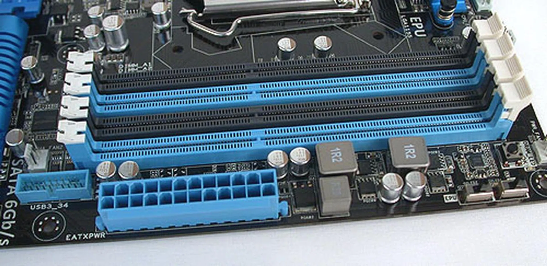 The expected four DIMM slots on this dual-channel memory architecture is more determined by the Sandy Bridge processor rather than the chipset or motherboard. Notice the single USB 3.0 header besides the 24-pin power connector.
